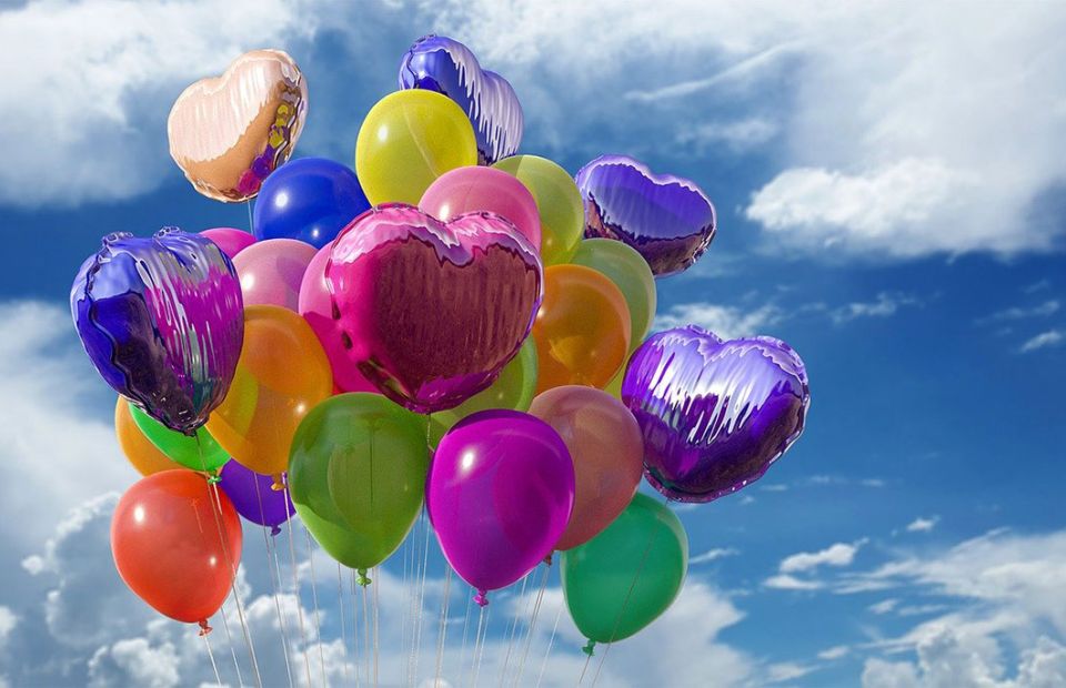 balloons floating off to the sky