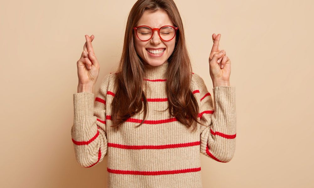 woman with fingers crossed